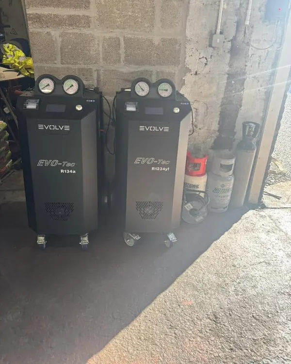 Two air con service machines in the workshop