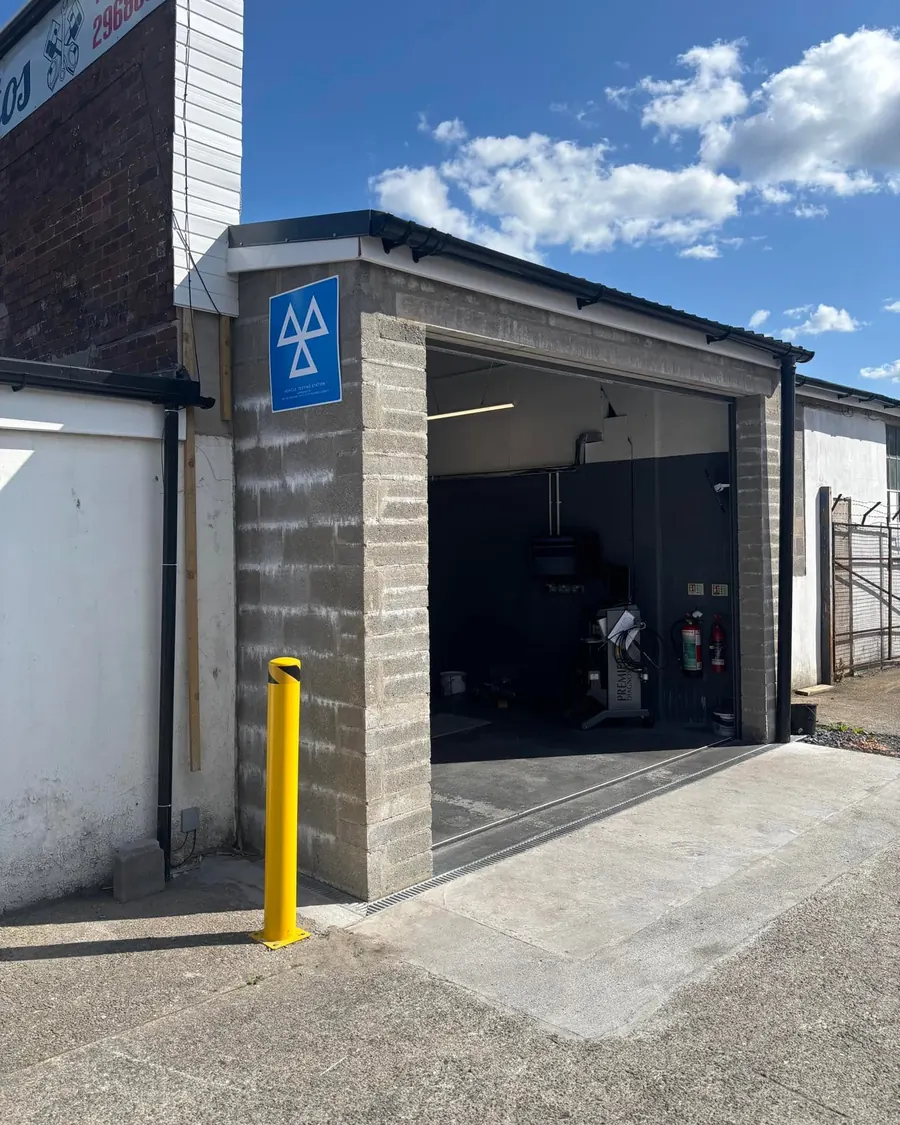 The MOT bay at Mike’s Autos, with the blue MOT sign by the door